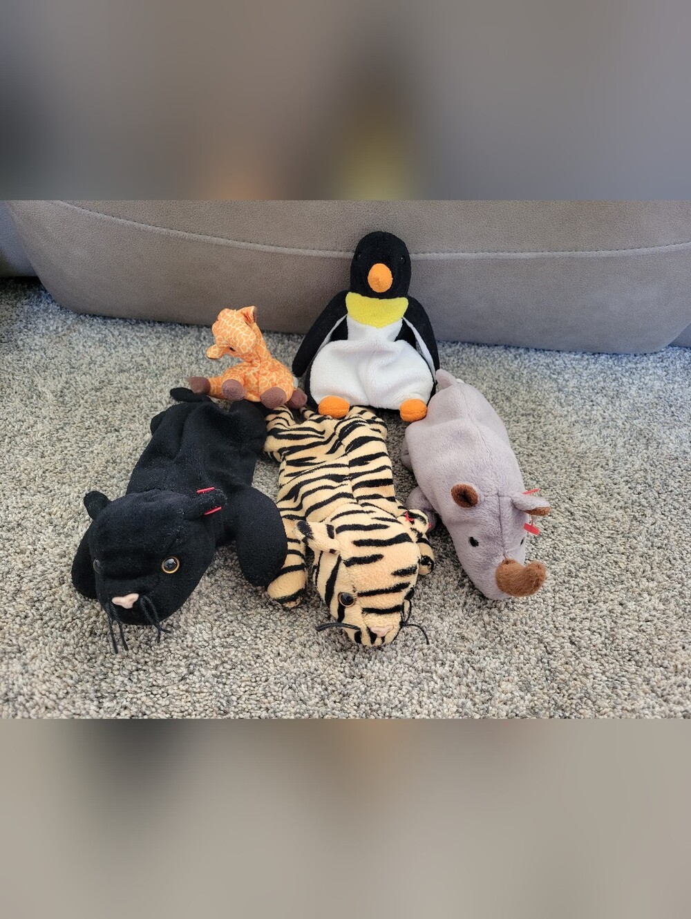 Bundle of ty beanie babies: rhinoceros, tiger, panther, penguin and mini giraffe